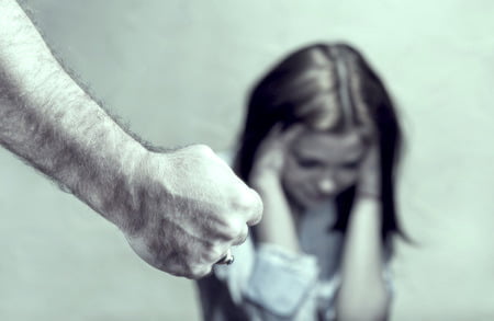 a female victim of sexual abuse trauma and male fist