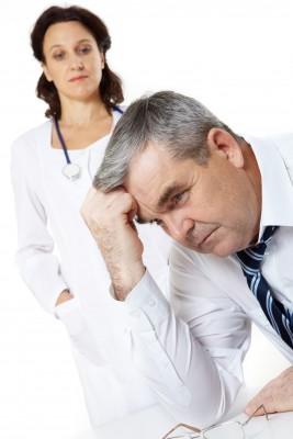 Older man stressed and his doctor