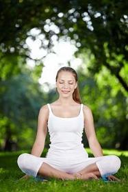 Woman meditates, calms her mind and nerves