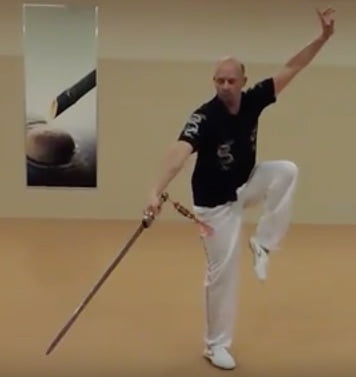 Volker demonstrates Tai Chi breathing pattern benefits with sword and focused movements