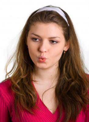Young woman practicing pursed lip breathing